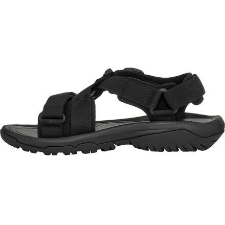 When we hike for leisure, we count on the Hurricane Verge Sandal to balance breathable comfort with optimal traction. The lugged rubber sole and raised heel provide a supportive trekking platform that won't slip when you encounter wet roots and loose shale on your next summer trek. Durable Sport Sandals With Round Toe For Outdoor Activities, Durable Round Toe Sport Sandals For Hiking, Durable Sport Sandals With Round Toe For Hiking, Durable Black Sandals For Outdoor Activities, Black Synthetic Sport Sandals For Outdoor, Waterproof Sport Sandals, Black Breathable Sport Sandals For Outdoor, Sport Sandals With Arch Support For Outdoor Activities, Functional Sports Sandals With Rubber Sole