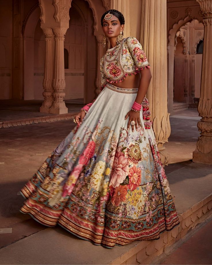 Featuring an elegant interplay of exquisite floral motifs with intricate hand embroidery on the lehenga. It is paired with a meticulously embroidered blouse with intricate thread and hand beadwork on yoke and sleeves and styled with a co-ordinated dupatta. Note: Potli is for styling purposes only Floral Lehenga, Floral Motifs, Embroidered Blouse, Raw Silk, Floral Motif, Modern Woman, Lehenga, Bead Work, Hand Embroidery