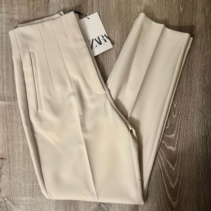 Pants With A High Waist And Pronounced Seams At Front And Back. Front Welt Pockets. Front Zip, Metal Hook, And Interior Button Closure. Measurements Size - Small Waist - 13” Rise - 12” Length - 26” Color - Oyster White Size - Small Condition - Nwt Oyster White, Zara Jumpsuit, Zara Pants, Metal Hooks, Small Waist, Fashion Sewing, Cream White, Welt Pocket, Welt Pockets