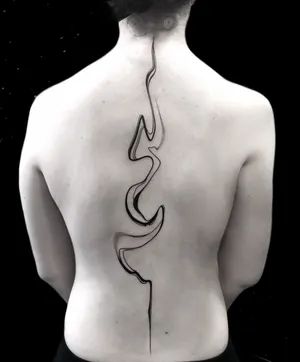 the back of a woman's body with a tattoo on it