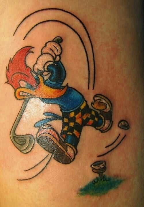 a cartoon character on the back of a woman's leg with an arm tattoo