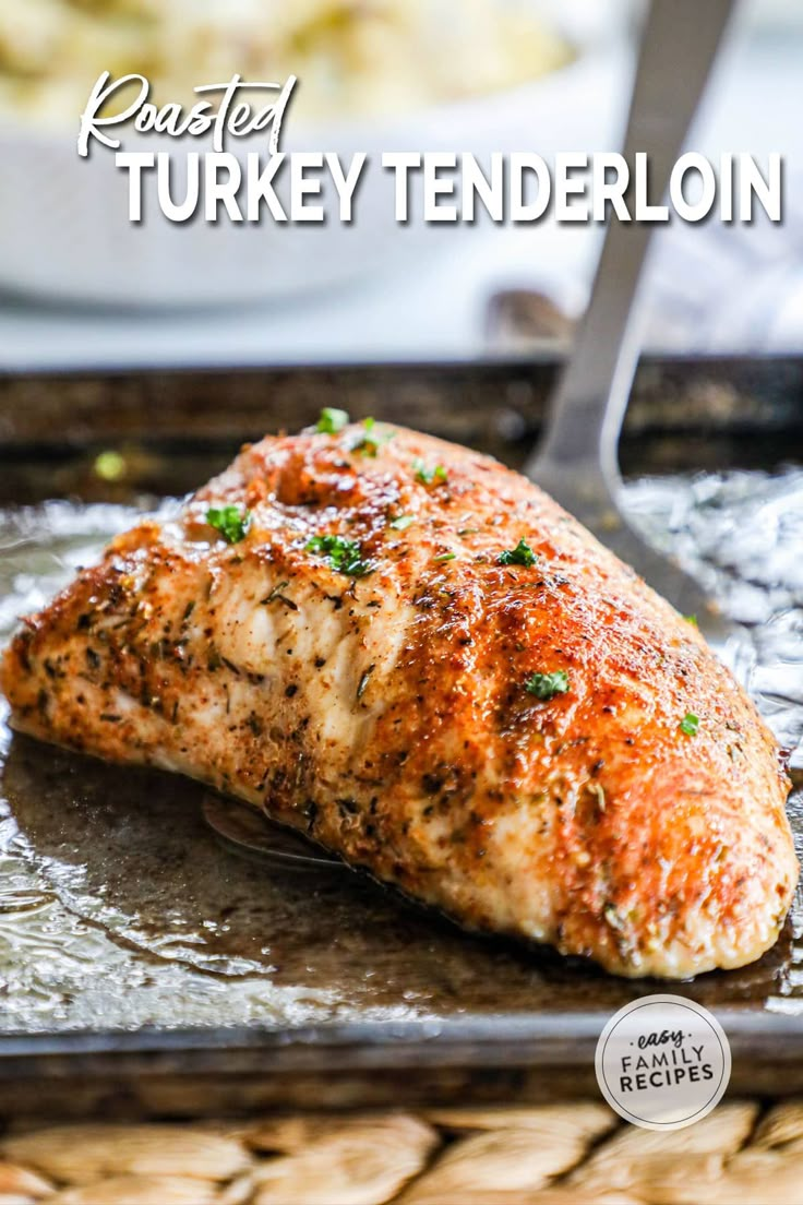 a close up of a piece of meat on a pan with the words roasted turkey tenderion over it