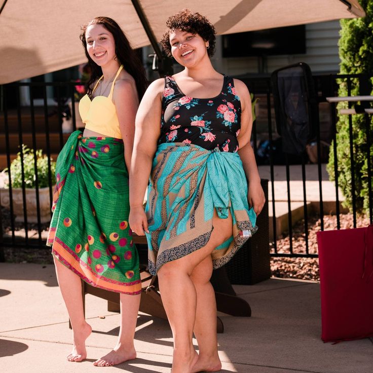 Why we love it! This beautiful sarong scarf is made from 100% reclaimed traditional sari material, and is the perfect coverup for a day at the beach. The lightweight fabric is perfect for hot days, and the colorful design will add a touch of fun and flair to any outfit. The long length makes it versatile - you can wear it as a scarf, wrap, or even a skirt! Color notes: No two sarongs are the same. Just tell us your requested colors at check out notes and our team will do our best to hand-select Bohemian Sarong With Tropical Print For Beach Season, Bohemian Batik Print Sarong For Festival, Green Bohemian Sarong For Vacation, Green Bohemian Sarong For Summer, Beachy Sarong With Tropical Print For Beach Party, Multicolor Tropical Print Beachy Sarong, Beachy Multicolor Sarong With Tropical Print, Beachy Multicolor Tropical Print Sarong, Bohemian Tropical Print Sarong For Beach Party