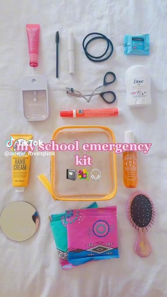 the contents of a school emergency kit laid out on a white sheet with text overlay