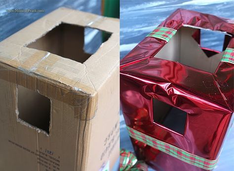 an open box sitting on top of a table next to another box that has been wrapped in foil