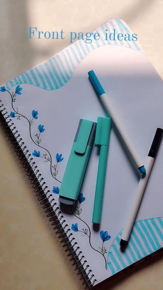 three pens sitting on top of a notebook with the words front page ideas written below