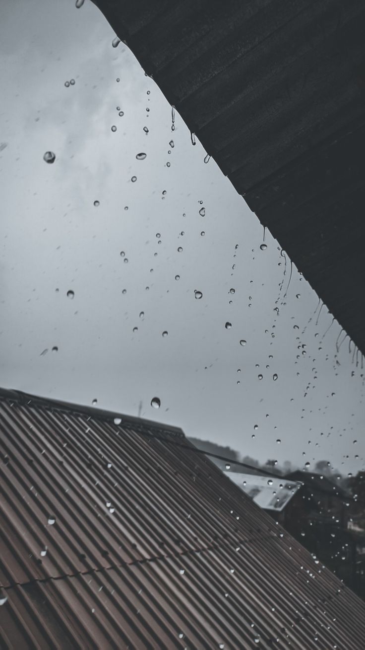 rain drops on the roof of a building