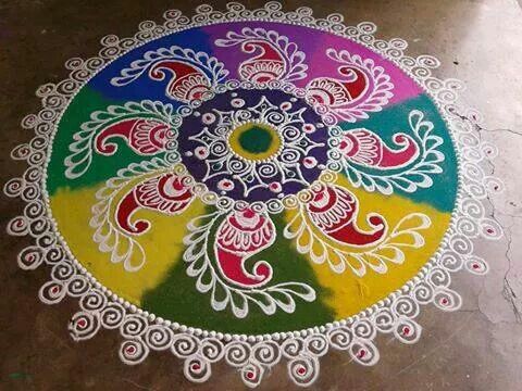 a colorful rangdi design on the ground