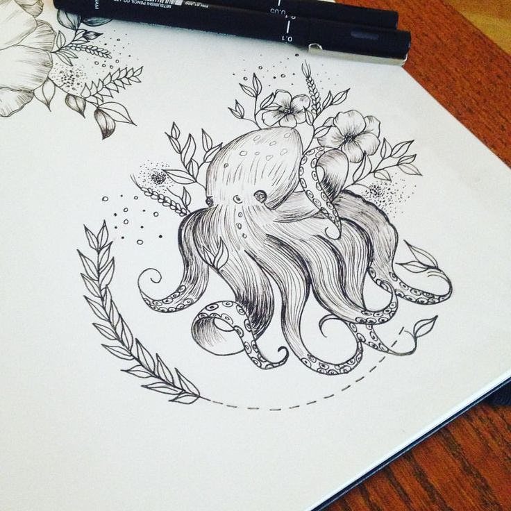 an octopus is sitting on top of a sheet of paper with flowers and leaves around it