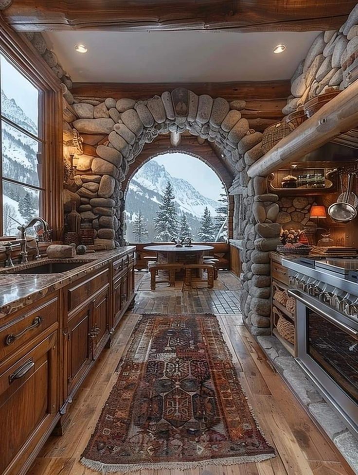 a kitchen with wooden cabinets and an arched window in the wall, along with a rug on the floor