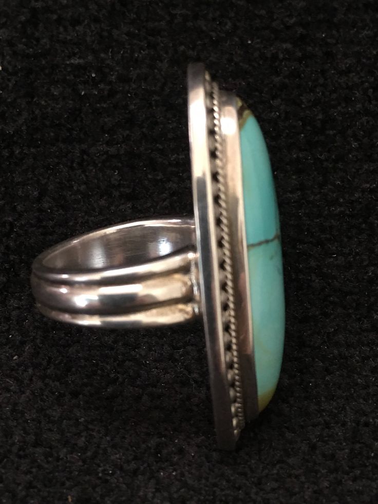 "Ring ~ Artist: Teresa Bradford-Cole Natural Stone Oval Turquoise Heavy Gauge Sterling Silver Be bold in style with this stunning long turquoise stone It features a long oval natural stone Many tribes considered turquoise to be a stone of the sky and wearing items of turquoise jewelry provided protection, good health, and long life. Size: 8 Length: 1 3/4\" Width:3/4 You deserve to know about my fabulous Treasure chest Modern Tribal Jewelry, Statement Piece Jewelry, Art to Wear Jewelry, Fantastic Artisan Oval Multi-stone Turquoise Ring, Classic Turquoise Ring For Formal Occasions, Luxury Turquoise Cabochon Ring, Classic Formal Turquoise Ring, Elegant Green Turquoise Ring, Oval Multi-stone Turquoise Ring, Oval Turquoise Multi-stone Ring, Elegant Turquoise Inlay Rings, Turquoise Multi-stone Round Gemstones