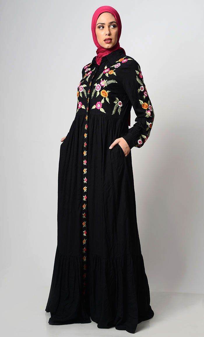 A perfect wardrobe piece for elegant style Simple and classy details A stylish abaya with hidden button down placket An abaya with embroidered front yoke, sleeves and placket Includes both side pockets Shirt Collar Loose belt included Full Sleeves with cuff FABRIC: Rayon CARE: Gentle Hand wash and drying Elegant Black Abaya With Floral Embroidery, Fitted Long Sleeve Abaya With Floral Embroidery, Black Long Sleeve Abaya With Floral Embroidery, Black Abaya With Floral Embroidery, Fitted Floral Embroidery Long Sleeve Abaya, Spring Black Maxi Length Abaya, Spring Black Maxi-length Abaya, Long Black Abaya For Spring, Black Long Abaya For Spring