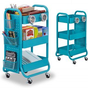 two blue trolleys with books, magazines and other items on them in front of a white background