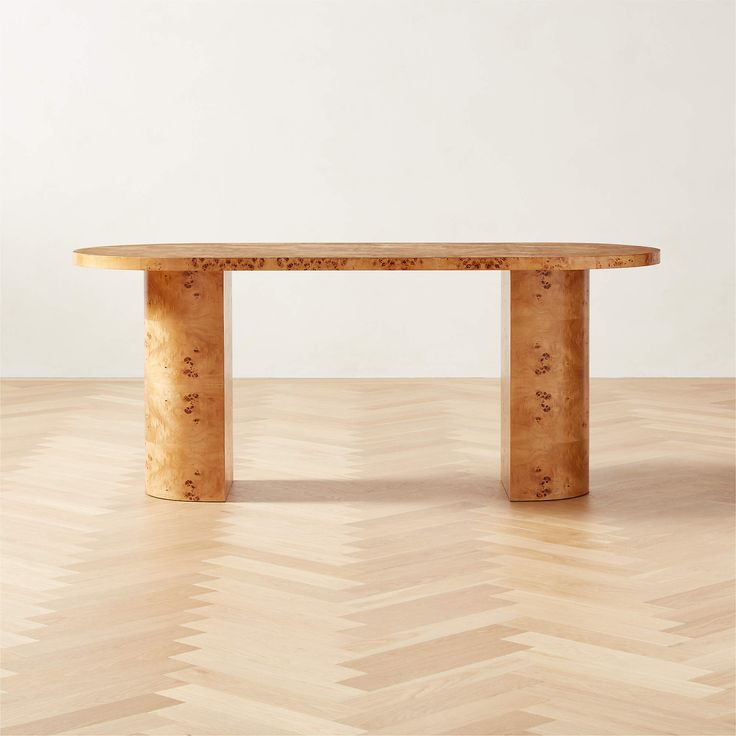 a wooden table sitting on top of a hard wood floor