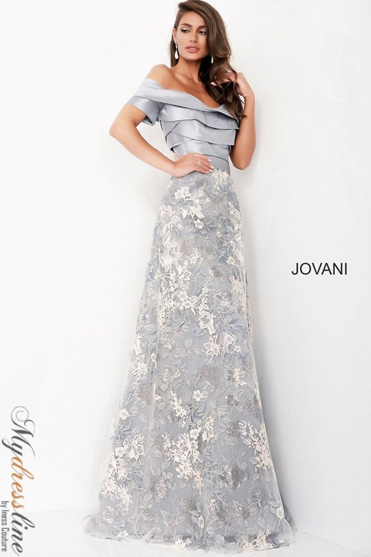 Indulge in elegance with the Jovani 02921 gown. Crafted from luxurious lace and taffeta, this A-Line masterpiece features a bateau neckline, short sleeves, and pleated skirt for added sophistication. Perfect for evening events, special occasions, and plus sizes. Elevate your style effortlessly. Gray Evening Gown, Formal Wedding Guest Dress, Formal Wedding Guests, Evening Gowns With Sleeves, Formal Evening Wear, Mother Of Groom Dresses, Evening Dresses With Sleeves, Full Length Gowns, Wedding Designer