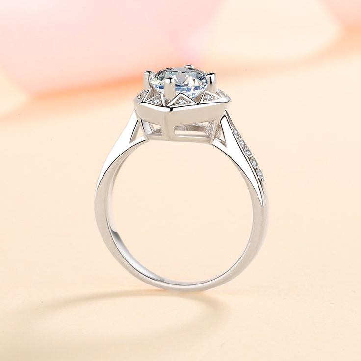 The Round Cut Moissanite Solitaire is set in a glamorous heart design head, making the ring ideal as a Promise or an Engagement Ring. The fancy design never goes out of style, and ladies who favor romance love it at first sight. Order this Moissanite Ring at the best price and indulge your loved one on a particular day. GRA Certificate & Deluxe Gift Box included. Engraving: Free Laser Engraved logo/number/name takes 5-7 days to handcraft. Contact us if you want to customize your design. AZ352-J Heart Engagement Ring, Heart Engagement, Fancy Design, Heart Engagement Rings, Moissanite Jewelry, Engraved Logo, Moissanite Ring, Moissanite Rings, 1 Carat