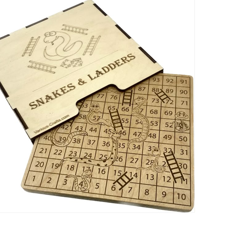 two wooden puzzles with snakes and ladders written on the front, one in white