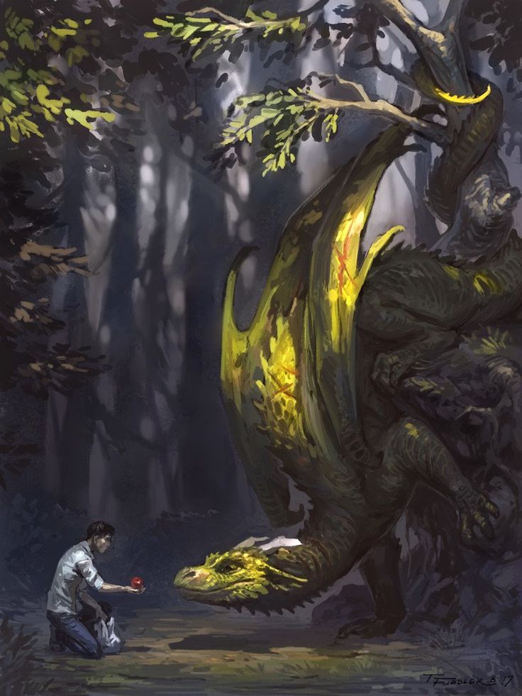 a man kneeling down next to a giant dragon in the forest with another person nearby