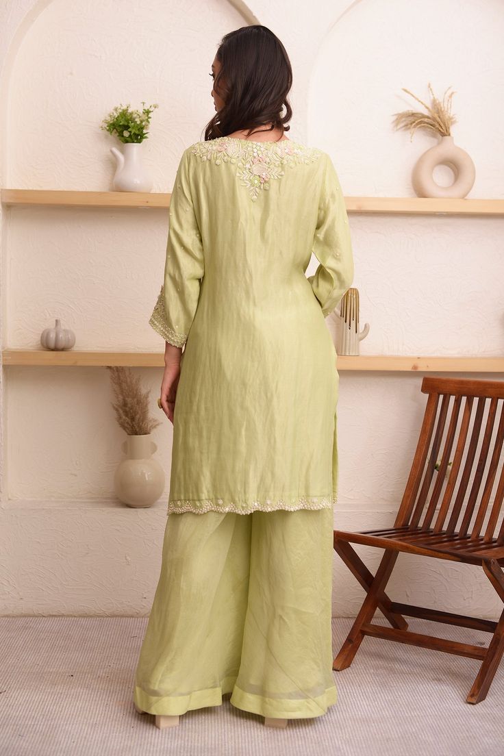 Light green kurta with floral, sequin embroidered bodice. Paired with sharara and chiffon dupatta.
Component: 3
Pattern: Embroidery
Type Of Work: Floral, sequin
Neckline: V neck
Sleeve Type: Three quarter
Fabric: Tissue, organza, chiffon
Color: Green
Other Details: 
Scallop bordered kurta
Sheer dupatta
Occasion: Sangeet - Aza Fashions V Neck Kurta, Sheer Dupatta, Kurta Sharara Set, Kurta Sharara, Embroidered Bodice, Chiffon Dupatta, Embroidery Floral, Sharara Set, Pattern Embroidery