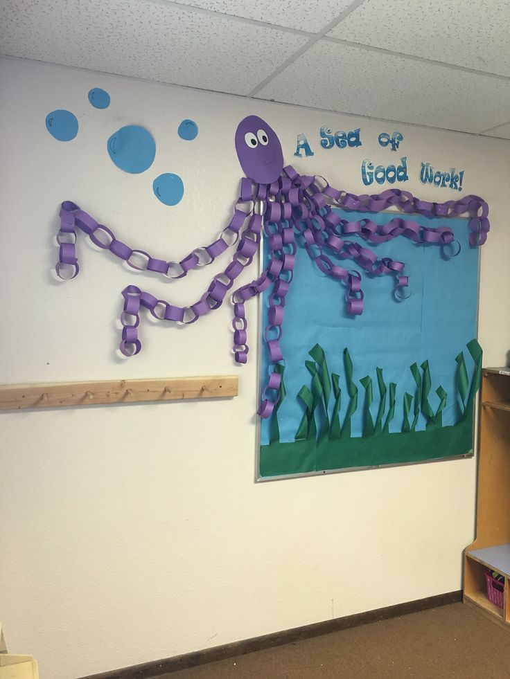 a classroom with an octopus theme on the wall