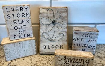 three wooden blocks with sayings on them