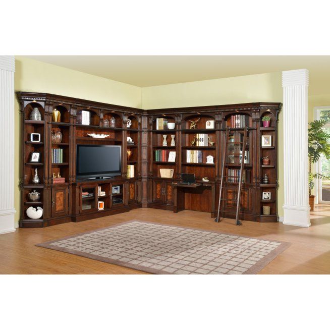 an entertainment center with bookshelves and ladders