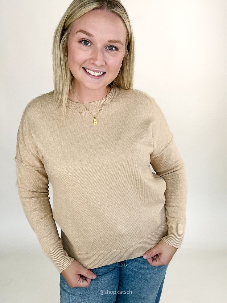 This cozy sweater, in a soft oatmeal, offers a timeless look that’s easy to dress up or down. Wear it alone for a simple, chic outfit, or layer it under a vest or flannel for added warmth and style. Available in small, medium, large, & extra large Color: Oatmeal Emily is 5'6" and has a 34c bust. She is wearing a medium. Runs true to size Ribbed round neckline Ribbed cuff and hem Paired here with our Megan Mid Rise Raw Hem Wide Leg Denim Beige Fine Knit Sweater For Fall, Beige Cashmere Tops For Fall, Casual Beige Cashmere Sweater, Cozy Neutral Top For Fall, Trendy Cozy Fit Beige Sweater, Casual Cashmere Tops For Fall, Chic Fall Tops With Soft Texture, Chic Soft Texture Tops For Fall, Chic Tops With Soft Texture For Fall