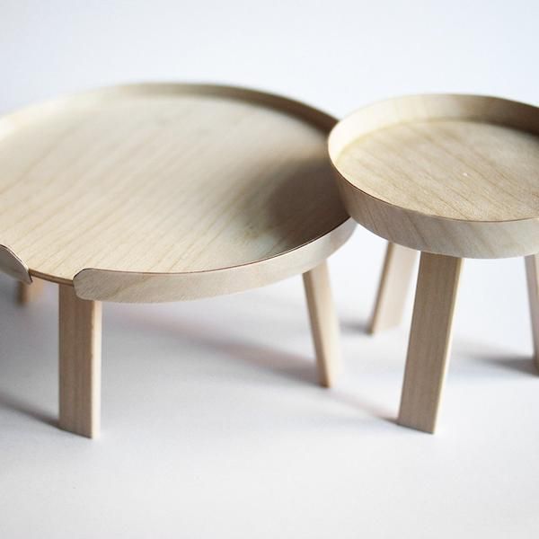 two small wooden tables sitting on top of each other