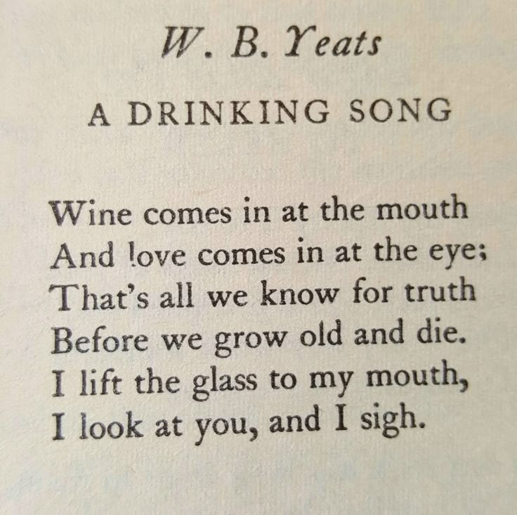 an open book with writing on it and the words w b yeats drinking song