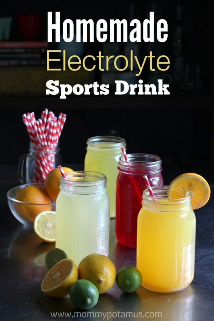 homemade electrolyte sports drink in mason jars with lemons and limes on the side