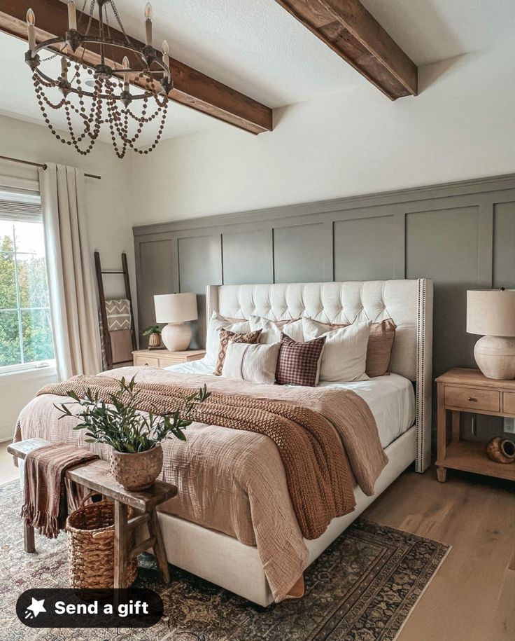 a bedroom with a large bed and chandelier hanging from it's ceiling