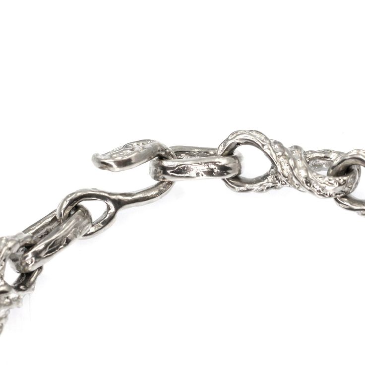 This beautiful Sterling Silver Bracelet is expertly designed and features a chain of handmade links that come together to create a timeless look for any occasion. This bracelet is approximately 9" long and comes with extra links you can remove to size it down to fit your wrist perfectly. This exquisite piece of jewelry is made from the finest sterling silver, ensuring that it will last for years to come. Whether you're looking for an elegant gift for a special someone or just treating yourself, Luxury Oval Link Chain Bracelet With Lobster Clasp, Silver Link Bracelets With Hook And Links, Formal White Gold Chain Bracelet With Hooks And Links, Silver Diamond Jubilee Bracelet With Oval Links, White Gold Bracelets With Oval Links, Elegant Silver Charm Bracelet With Cable Chain, Sterling Silver Bracelet With Oval Links, Formal Chain Link Bracelet With Hook And Links, Elegant Oval Link Sterling Silver Bracelet