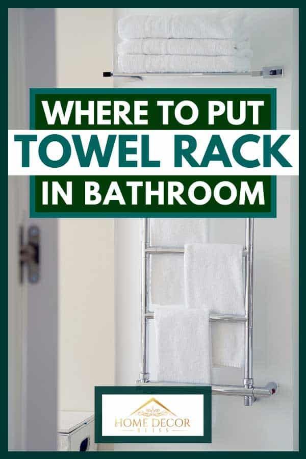 there is a sign that says where to put towel rack in bathroom with towels on it