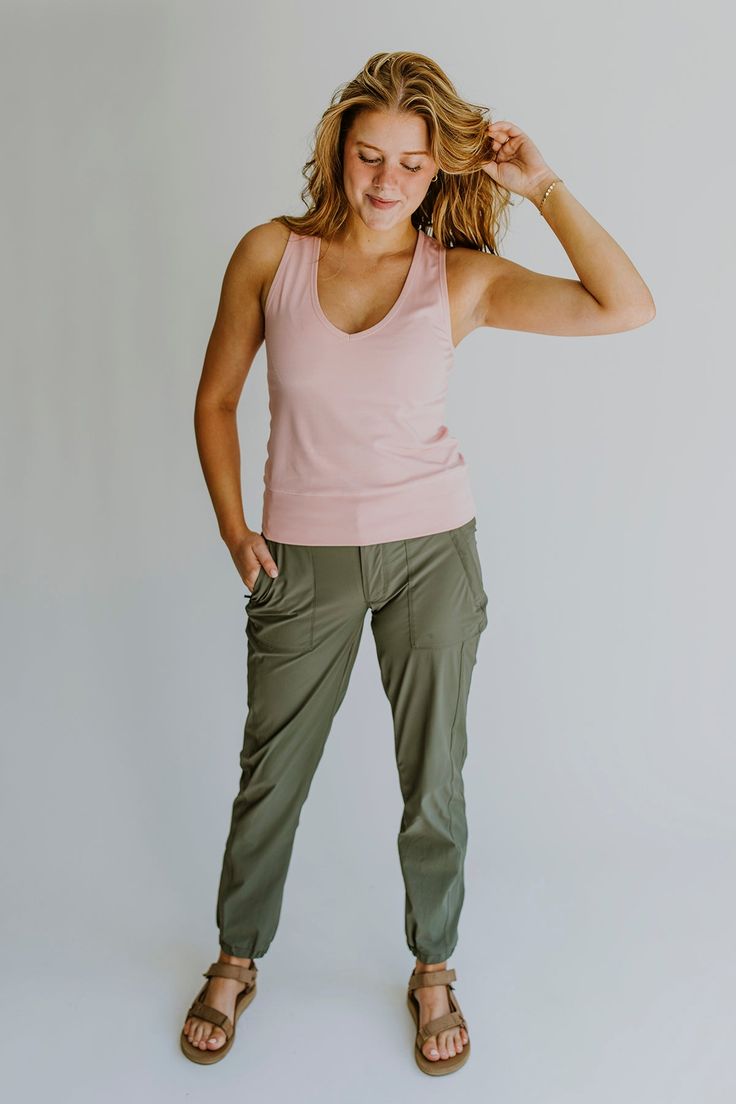 The Hallie Adventure Tank is a v-neck tank top that maximizes comfort. You will love the soft, smooth, and luxurious feel of the fabric and you will come to count on the breathable, anti-static, strong, and durable nature of bamboo. Wear the Hallie Adventure Tank on your next adventure or your next workout. We promise you'll love it. Fabric Content: 90% bamboo 10% spandex Available in women's sizes: XS (0-2) S (4-6) M (8-10) L (12-14) XL (16-18) 2XL (20-22) Athleisure 2024, Women's Athleisure, Hiking Clothing, Outfit Hiking, Hiking Pants Women, Womens Athletic Outfits, Womens Outdoor Clothing, Women Jogger Pants, Women's Athletic Wear