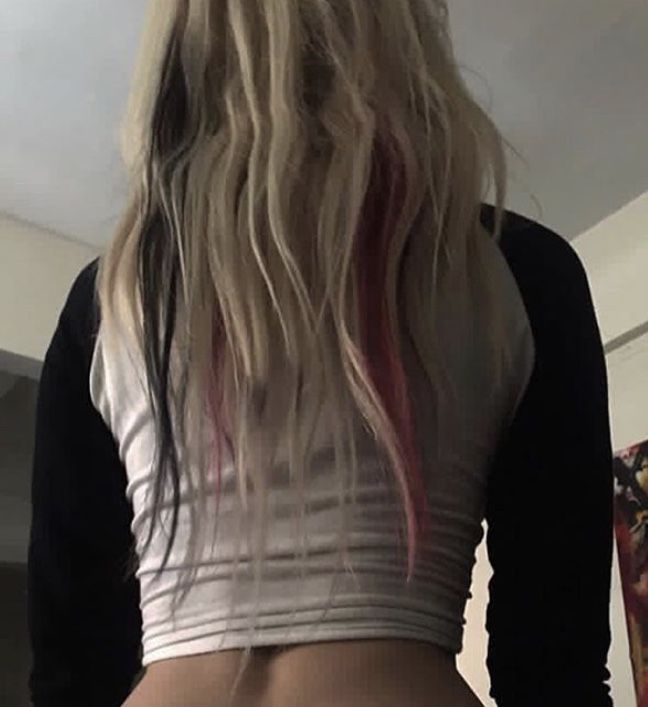 the back of a woman's body with long blonde hair