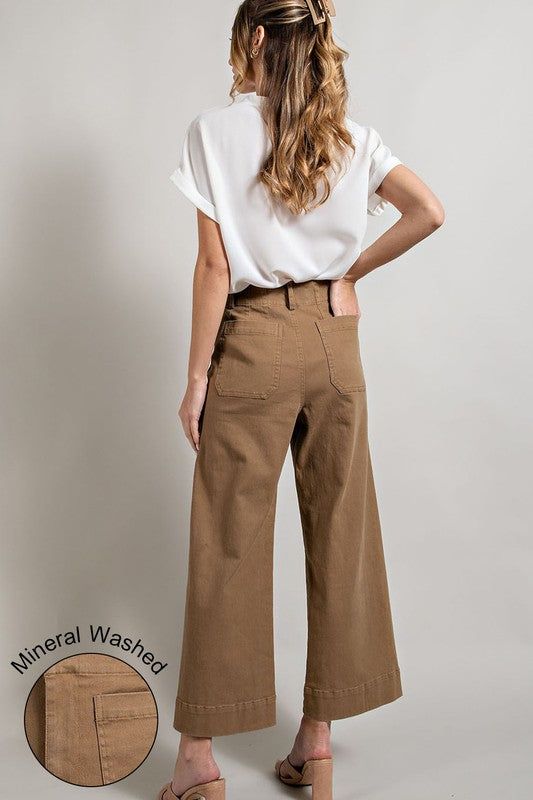 Soft washed wide leg pants with button closure and two front pockets. Can also be worn with a belt. Pair with your favorite top and booties!Model is 5'8" and wearing a small. Made In: IMPORT Fabric Contents: 100% COTTON Non-stretch fabric Non-sheer fabric Size Measurement (inch): S: 14.0 (Waist), 18.0 (Hips), 26.5 (Inseam), 38.5 (Length) M: 15.0 (Waist), 18.5 (Hips), 27.0 (Inseam), 39.0 (Length) L: 16.0 (Waist), 19.5 (Hips), 27.5 (Inseam), 29.5 (Length) Casual High Rise Pre-washed Bottoms, Brown Wide Leg Work Jeans, Brown Wide Leg Jeans For Work, Fall Wide Leg Flare Jeans With Button Closure, Wide Leg Brown Flare Jeans For Work, Spring Utility Wide Leg Flare Jeans, Casual Wide Leg Pants With Button Closure, Full Length, Cotton Flare Jeans With Belt Loops For Work, Everyday Wide Leg Bottoms For Fall