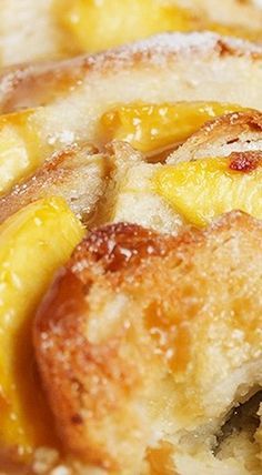 a close up view of some bread with bananas on it and powdered sugar around the edges