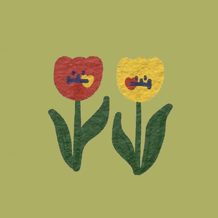 two tulips with faces drawn on them are in the middle of green background