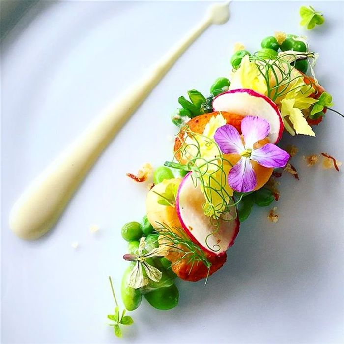 a white plate topped with fruit and veggies