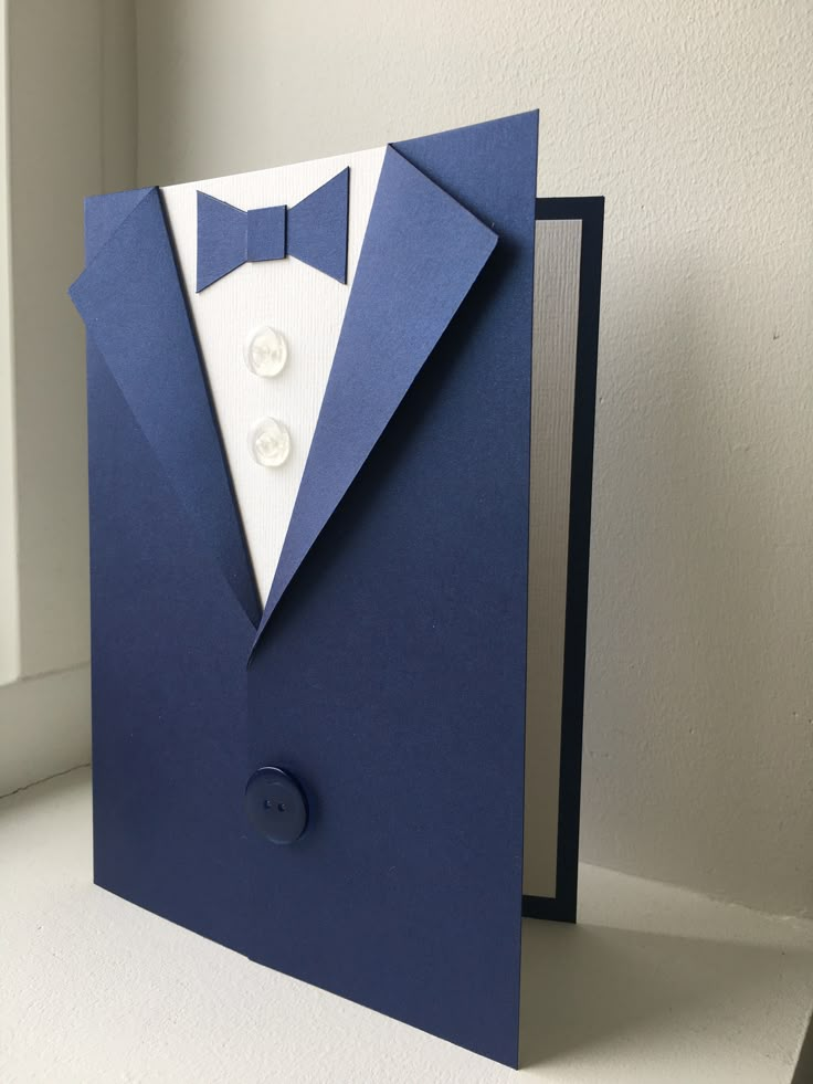 a card with a tuxedo and bow tie on it