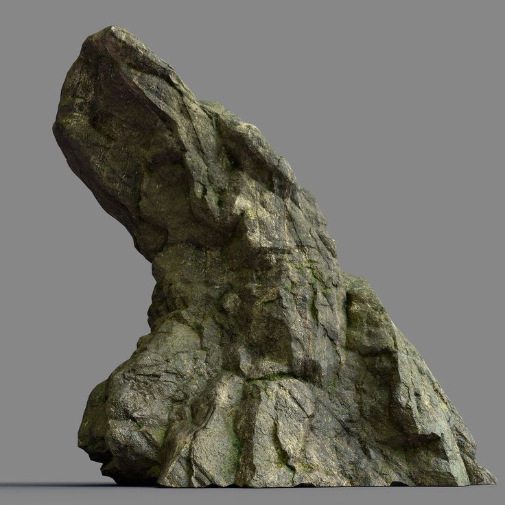 a large rock formation in the shape of a head on top of a mountain side