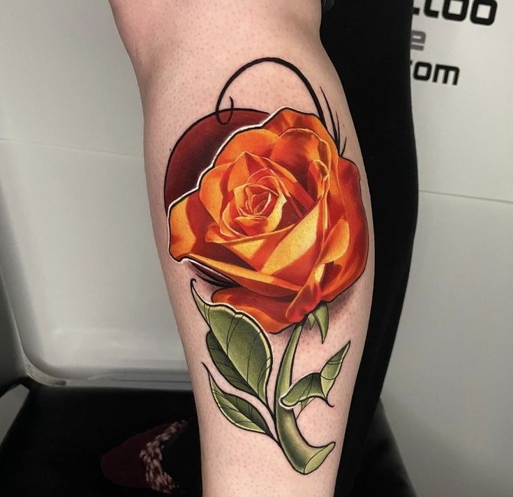 an orange rose with green leaves on the arm