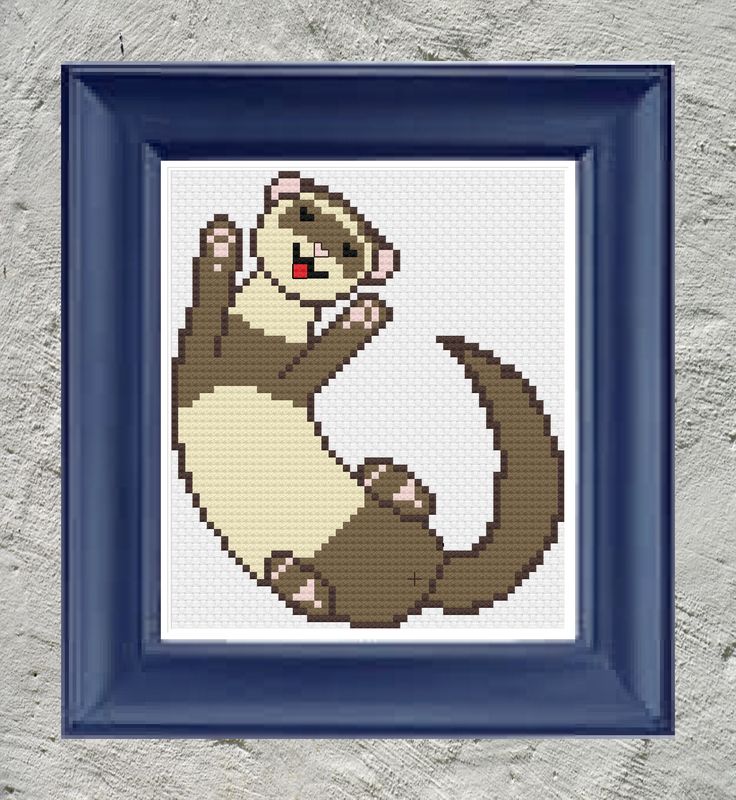 a cross stitch monkey is sitting on its back in a blue frame with a white wall behind it