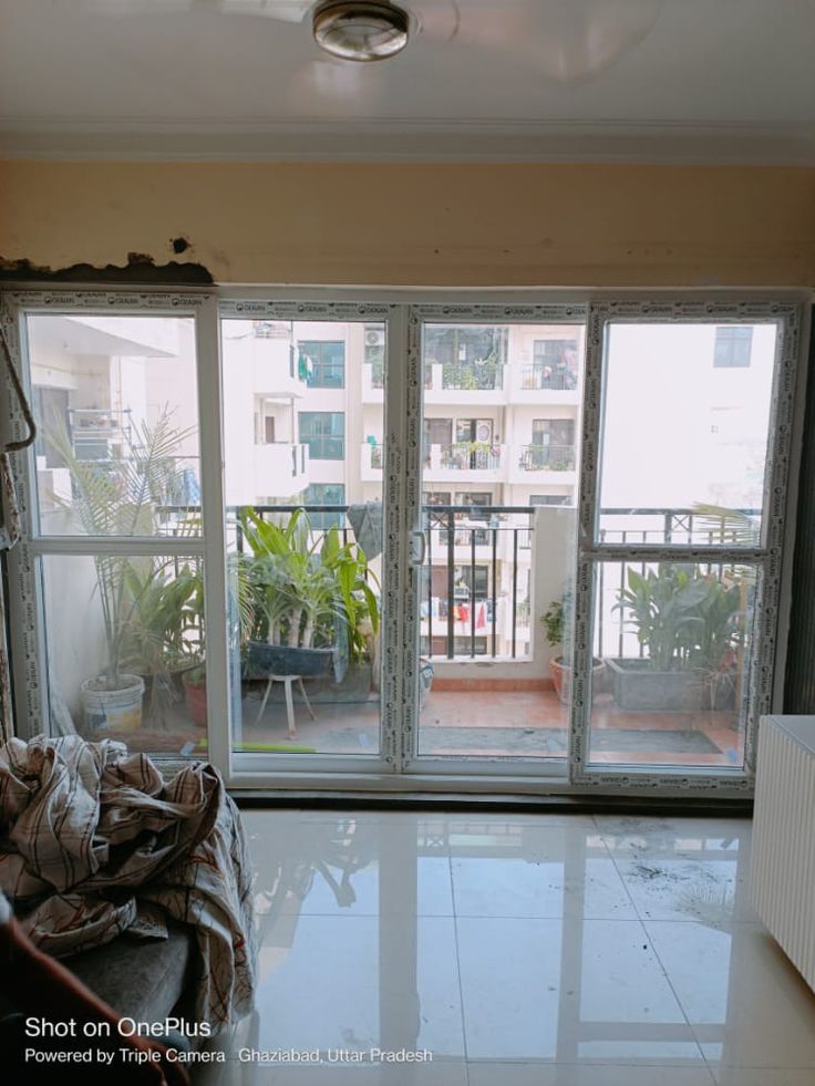 an empty living room with sliding glass doors