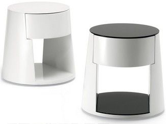 two white and black tables sitting next to each other