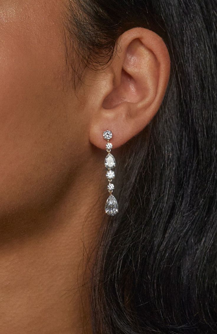 Complete your look with the sparkling glamour of these linear drop earrings set with faceted stones. 1 5/8" drop; 1/4" width Post back Rhodium or 18k-gold plate/cubic zirconia Imported Dangly Wedding Earrings, Formal Silver Jewelry, Long Drop Linear Earrings With Diamond Accents, Linear Drop Earrings With Sparkling Cubic Zirconia Stones, Long Drop Cubic Zirconia Linear Earrings, Cubic Zirconia Long Drop Linear Earrings, Sparkling Cubic Zirconia Linear Dangle Earrings, Long Drop Linear Earrings With Cubic Zirconia, Long Drop Cubic Zirconia Crystal Earrings