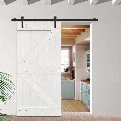 an open barn door in the middle of a kitchen