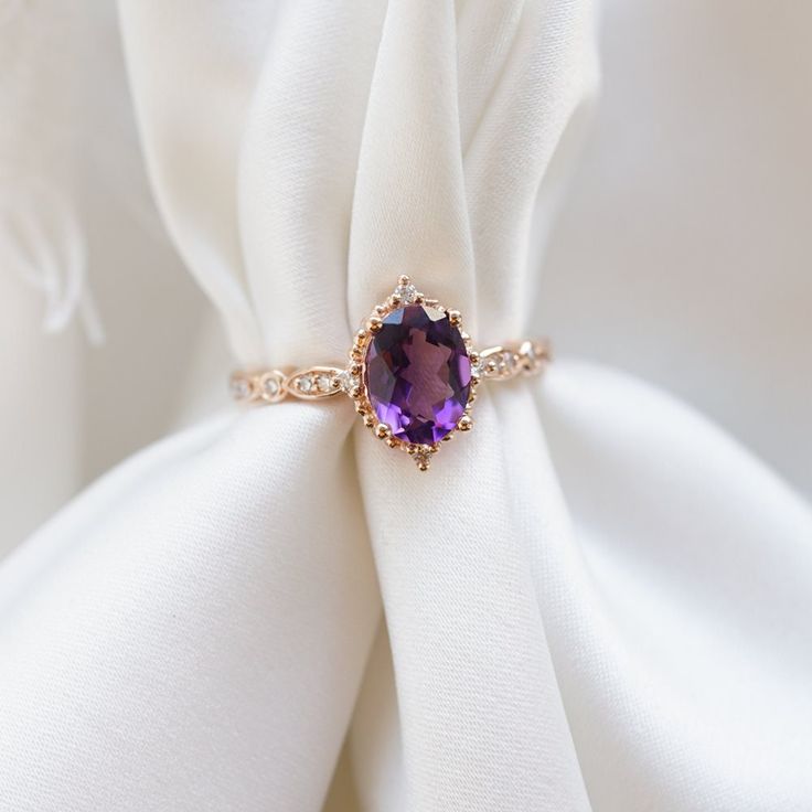 "♥ Lilia Feel the smell of lilies of the valley and imagine a luxurious velvety purple engagement ring on your left hand-It sounds like a matchy match for romantic souls. We present you \"Lilia\", our gentle and charming ring choice for the future brides. The oriental amethyst gem surrounded by genuine diamonds completes the image of unconditional love of those who are about to get engaged. The special and feminine \"Lilia\" will always get her Prince Charming. ---------------------------------- Luxury 14k Gold Purple Rings, Luxury Purple 14k Gold Rings, Timeless Purple Rings As Gifts, Timeless Purple Rings Perfect For Gifts, Timeless Purple Rings For Gifts, Timeless Purple 14k Gold Rings, Timeless 14k Gold Amethyst Ring For Anniversary, Timeless Amethyst Promise Ring, Elegant Lavender Amethyst Ring In 14k Gold