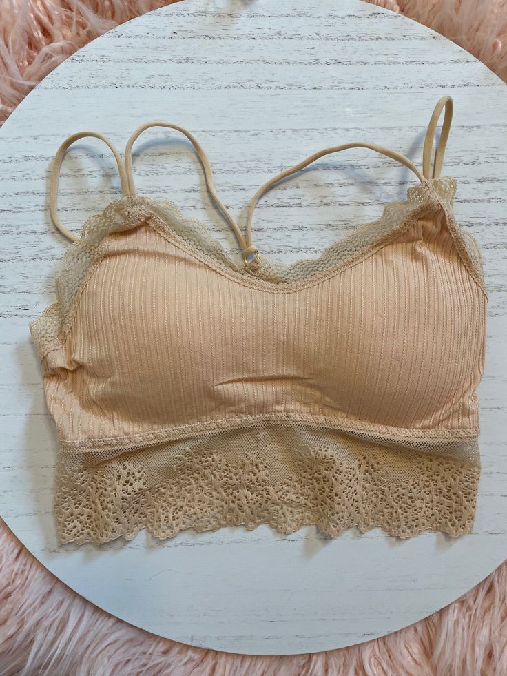 Lace Trim Bralette - Works for an everyday bra, or if you're wearing an off the shoulder top and going for a fun look! Comes in White, Tan & Mauve One-Size - Removable Padding Inserts Strapless Bra With Removable Pads For Spring, Spring Cami Bra With Built-in Support, Trendy Spring Bra With Removable Pads, Stretch Seamless Spring Bra, Spring Seamless Stretch Bra, Spring Cami Bra With Removable Pads, Spring Stretch Bra With Adjustable Straps, Spring Spaghetti Strap Bra, Spring Bandeau Camisole With Built-in Bra