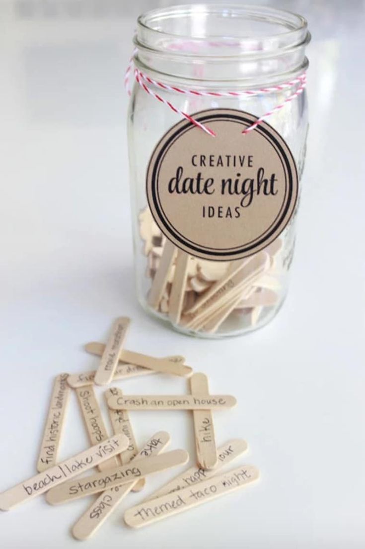 a jar filled with wooden clothes pins next to a tag that says pretty date night